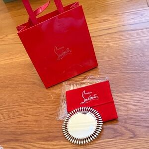 Christian Louboutin Silver Solar Mirror Holder.